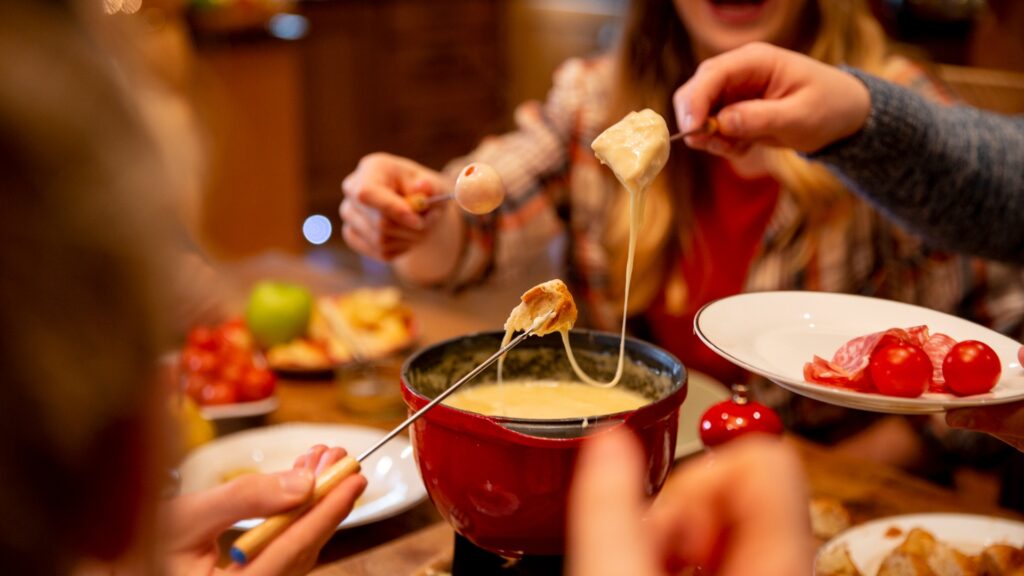 coworkers eating fondue picture id976629712